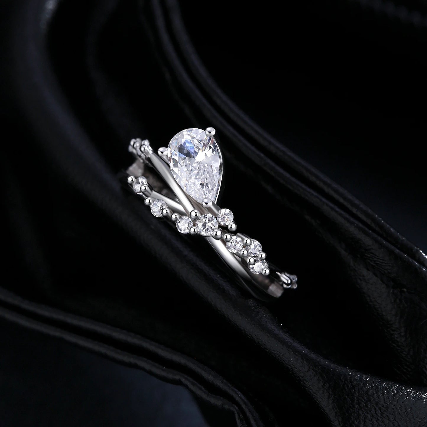 Sterling Silver Entangled Lines Water Drop CZ Ring